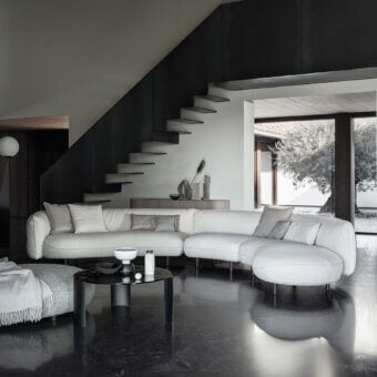 Distinguished Cierre1972 Seed sectional upholstered in light cream textured textile with a matte finish