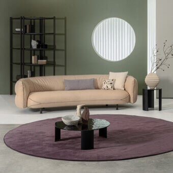Harmonious Cierre1972 Seed sofa upholstered in light beige smooth textile with slim dark metal legs and neutral cushions