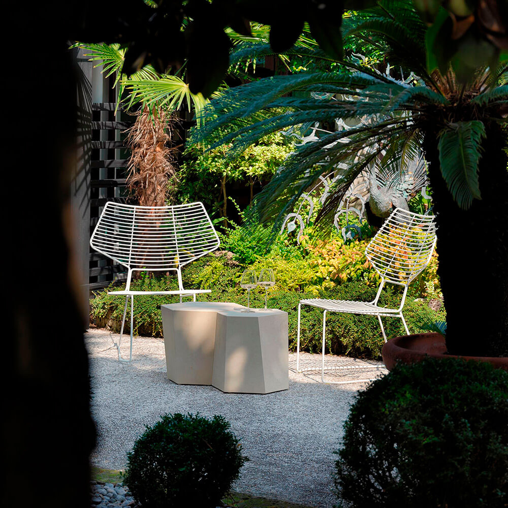 Distinguished Casamania Alieno lounge chair with geometric silhouette and matte white painted metal construction