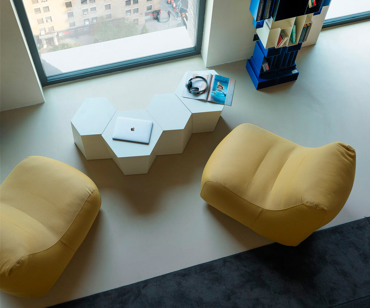 Exceptional Casamania Morfino lounge chair with enveloping form and muted yellow leatherette upholstery, exhibiting a textured matte finish