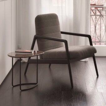 Elegant Horm Carnaby lounge chair with horizontally striped gray fabric upholstery and matte wooden base
