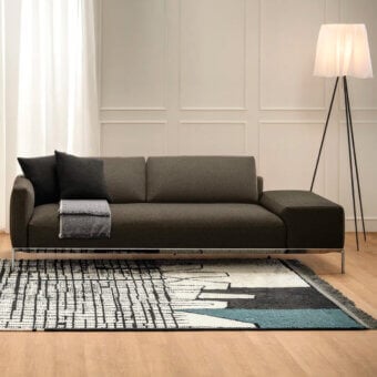 Superior Horm Dizzy sofa with a light aluminum frame showcasing Made in Italy tailoring and dark brown matte textile upholstery
