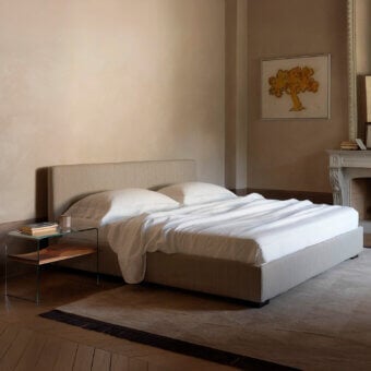 Superior Horm Lipari bed with light gray textile upholstery and mocha lacquered solid beechwood feet