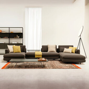 Exceptional Horm Miles sectional with a linear silhouette, dark gray textile upholstery and matte finish