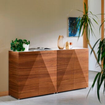 Innovative Horm Not Riddled sideboard with geometric lines and diamond-shaped wood-fabric doors revealing concealed storage