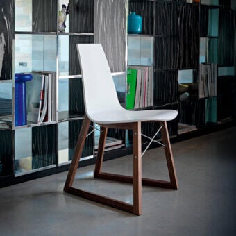 Elegant Horm Ray chair with curved white lacquered plywood body and dark brown finished premium wood base built with chrome-plated steel cross-bars
