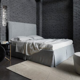 Distinguished Horm Sardegna bed with light gray textile upholstery and concealed beechwood feet offers contemporary style