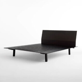 Elegant Horm Sottiletto bed with dynamically shaped plywood headboard and square veneered plywood feet in a dark matte finish