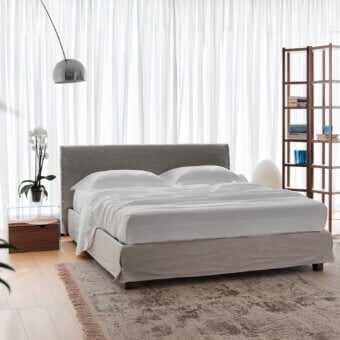 Superior Horm White bed with gray textile upholstery and mocha lacquered solid beechwood feet crafted in Italy