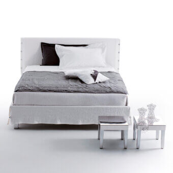 Elegant Horm White bed with off-white textile upholstery, subtle button embellishments and discreet metal legs