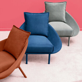 Distinguished Miniforms Lem lounge chair with curved silhouette and orange-brown textile upholstery with color-matched metal legs