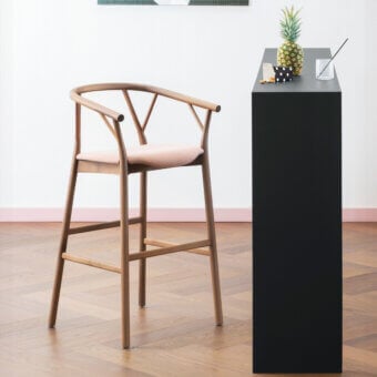 Distinguished Miniforms Valerie stool with light-brown curved wood frame and light pink upholstered seat