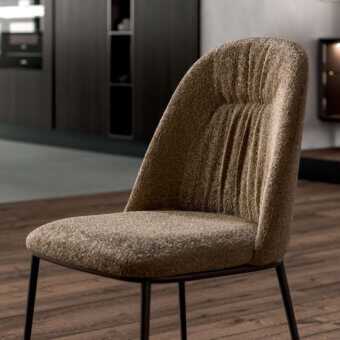 Superior Ozzio Italia Juliette chair with warm brown textured fabric and sleek matte black tapered metal legs