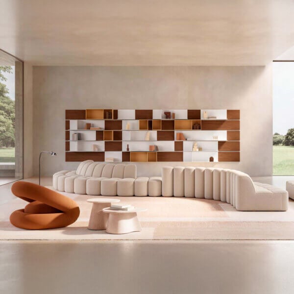 Beige modular sofa with curved segments, walnut & white shelving unit, terracotta chairs on rug, stone coffee table, minimalist living room.
