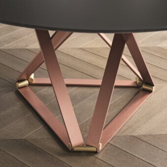 Superior Bontempi Delta round table with dark gray tabletop and geometric base crafted in light-reddish-brown matte metal with golden accents