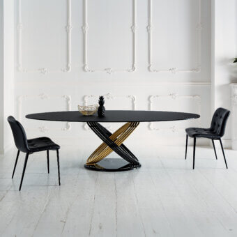 Distinctive Bontempi Fusion table with interwoven black and gold metal base supporting a smooth dark tabletop