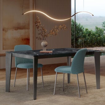 Distinguished Bontempi Infinity suspension lamp with a wave-shaped form emitting a warm yellow glow crafted in Italy