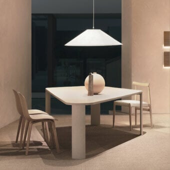 Superior MDF Italia Bonnet table with trapezoidal form, Coccioperla finish, and luminous mortar aggregate composition