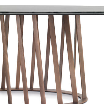 Distinguished Pacini & Cappellini Cosmo table with a tempered glass top and twisting bronze painted metal bars forming a geometric base