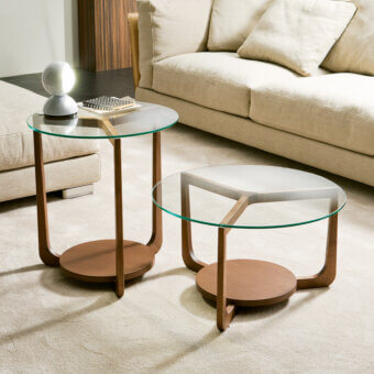 Elegant Pacini & Cappellini Isola coffee table with clear glass and veneered ash, built with a medium brown solid wood structure