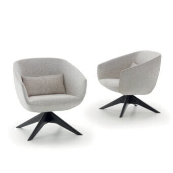 Elegant Pacini & Cappellini Mya lounge chair with a light grey fabric shell and solid ash wood base featuring a dark painted finish