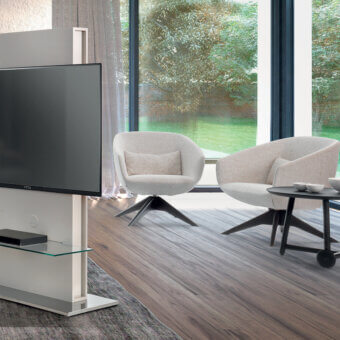 Superior Pacini & Cappellini Mya lounge chair with light beige textured fabric and dark swivel base