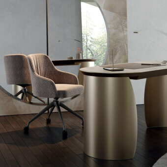 Refined Reflex Comfort chair with textured muted brown-gray textile and metallic tone wooden structure