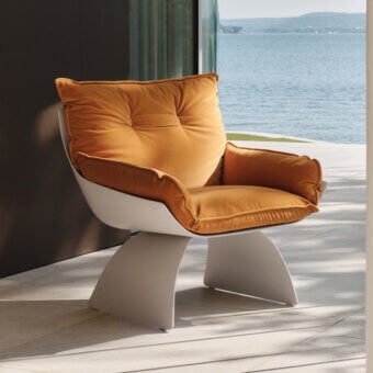 Exceptional Turri Silhouette lounge chair with golden-yellow cushions upholstered in fabric or leather and smooth off-white frame