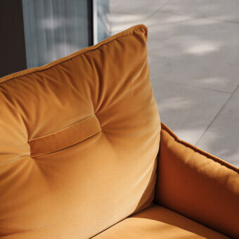 Distinguished Turri Silhouette lounge chair crafted in Italy with inviting mustard-colored velvet upholstery and unique upside-down frame