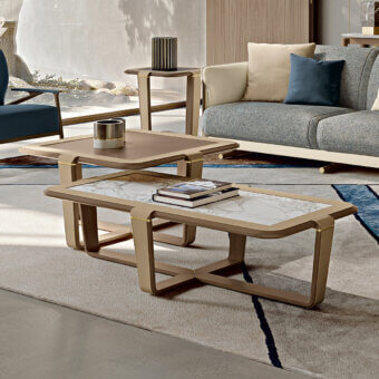 Superior Turri Vine coffee table with a rectangular light-colored marble top and brushed gold embellished wooden base
