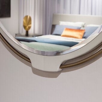 Superior Turri Vine Round mirror with brushed gold metal and light off-white leather, crafted with a smooth matte finish