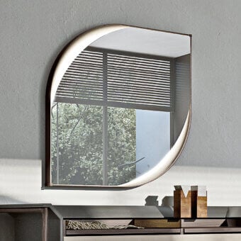 Elegant Turri Vine Teardrop mirror with brushed gold metal frame and soft leather applications illuminated by hidden internal lighting