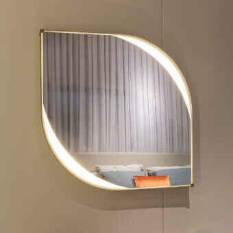 Distinctive Turri Vine Teardrop mirror crafted in brushed gold metal with leather applications and internal LED lighting