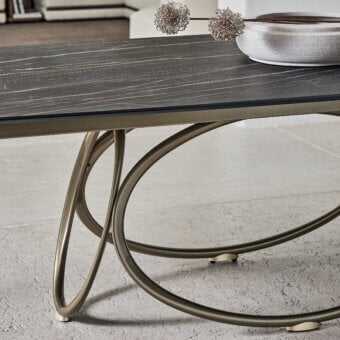 Distinguished Bontempi Louis Barrel table with a dark marbled top and bronze-toned metal frame built with interconnected curved supports