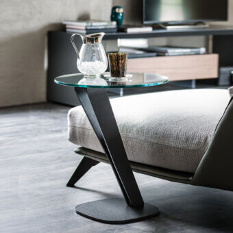 Distinguished Cattelan Italia Falco side table with transparent glass top and matte black industrial steel base