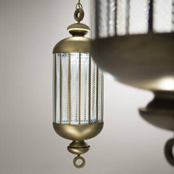 Refined Italamp Fata Morgana suspension lamp with transparent hand-carved glass and bronze-toned metal in antique burnished finish