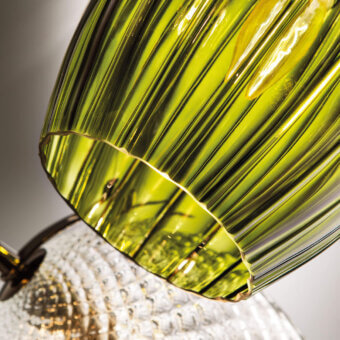 Distinguished Italamp Nuce suspension lamp with gracefully curved olive green blown glass and iron grey metal structure