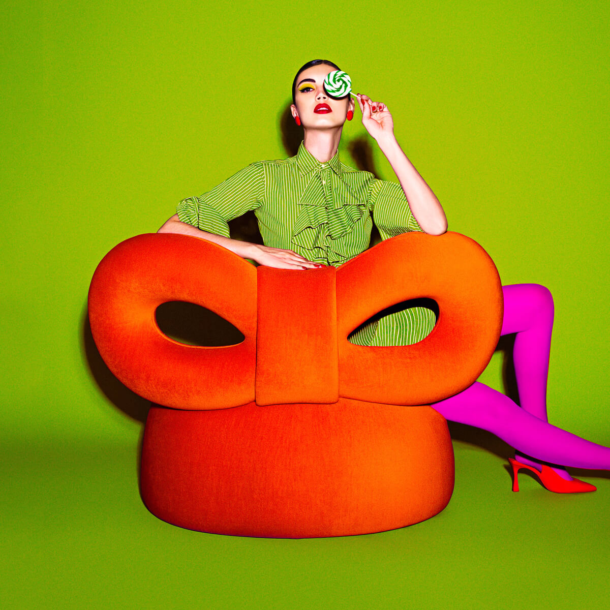 Distinguished QEEBOO Ribbon Lounge chair with vibrant orange fabric upholstery and smooth matte finish