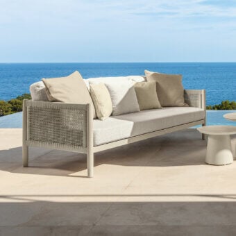 Distinguished Talenti Dolcevita Alu sofa with light aluminum frame and woven synthetic panels complemented by textile cushions with a matte finish