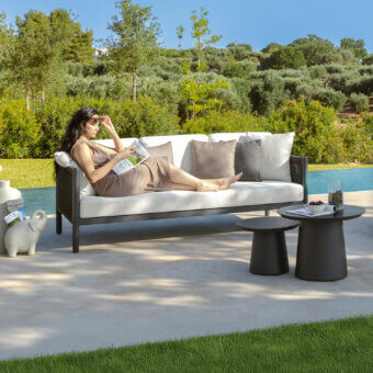 Sophisticated Talenti Dolcevita Alu sofa with a dark aluminum frame and light textile cushions for outdoor relaxation