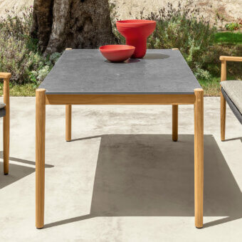 Distinguished Talenti Dolcevita Wood table with dark gray stoneware surface and satin natural teak frame