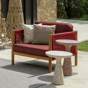 Superior Talenti Dolcevita Wood lounge chair with red woven seat and gray cushions crafted in wood