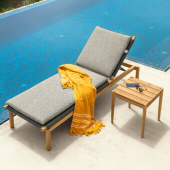 Sophisticated Talenti Dolcevita Wood lounger with textured grey textile upholstery and smooth wood frame