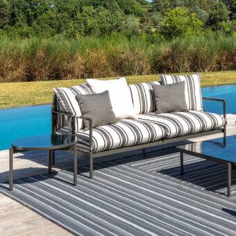 Distinguished Talenti Nalu sofa with black and white striped cushions and semi-polished aluminum frame