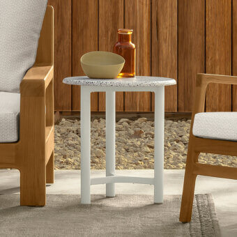 Elegant Talenti Oliver side table with speckled white and gray terrazzo top and cylindrical white metal legs and supports