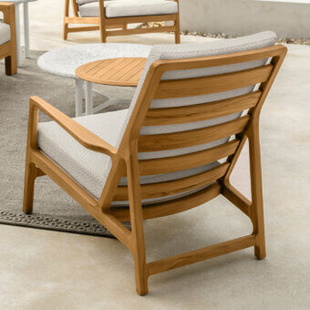 Sophisticated Talenti Oliver lounge chair with enveloping white cushions and a light brown teak wood frame