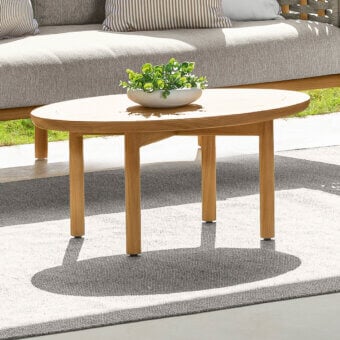 Exceptional Talenti Prichi coffee table crafted in teak with a smooth matte finish and contemporary curved lines