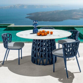 Distinguished Talenti Swipe chair with a dynamic navy blue aluminum structure and soft gray textile seat