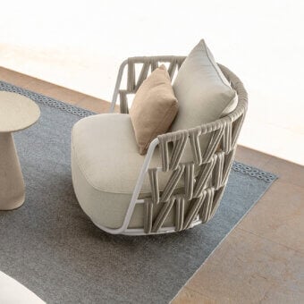 Superior Talenti Swipe swivel lounge chair with light gray powder-coated aluminum and soft light beige woven cushion