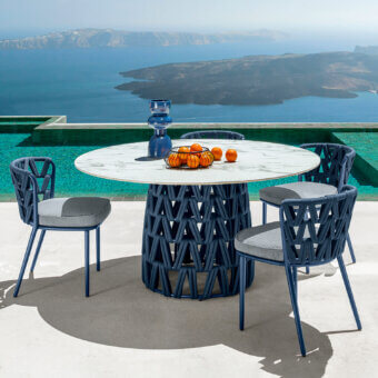 Distinguished Talenti Swipe table with a round stoneware top displaying gray veining and a woven dark blue padded string base crafted in Italy